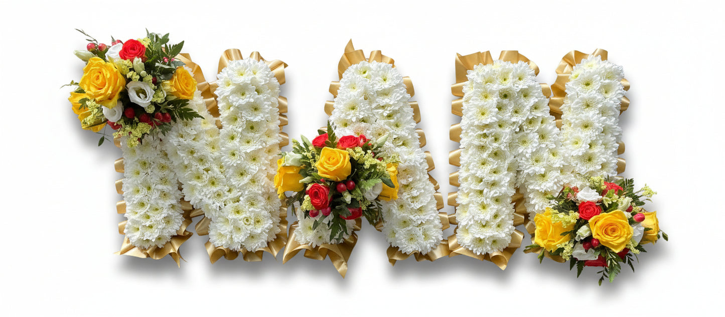 Floral arrangement spelling out 'MOM' with white, yellow, and red flowers on a white background