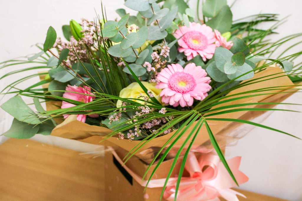 The Sophia bouquet of pink and white roses, held or displayed in a vase – elegant floral arrangement for gifting