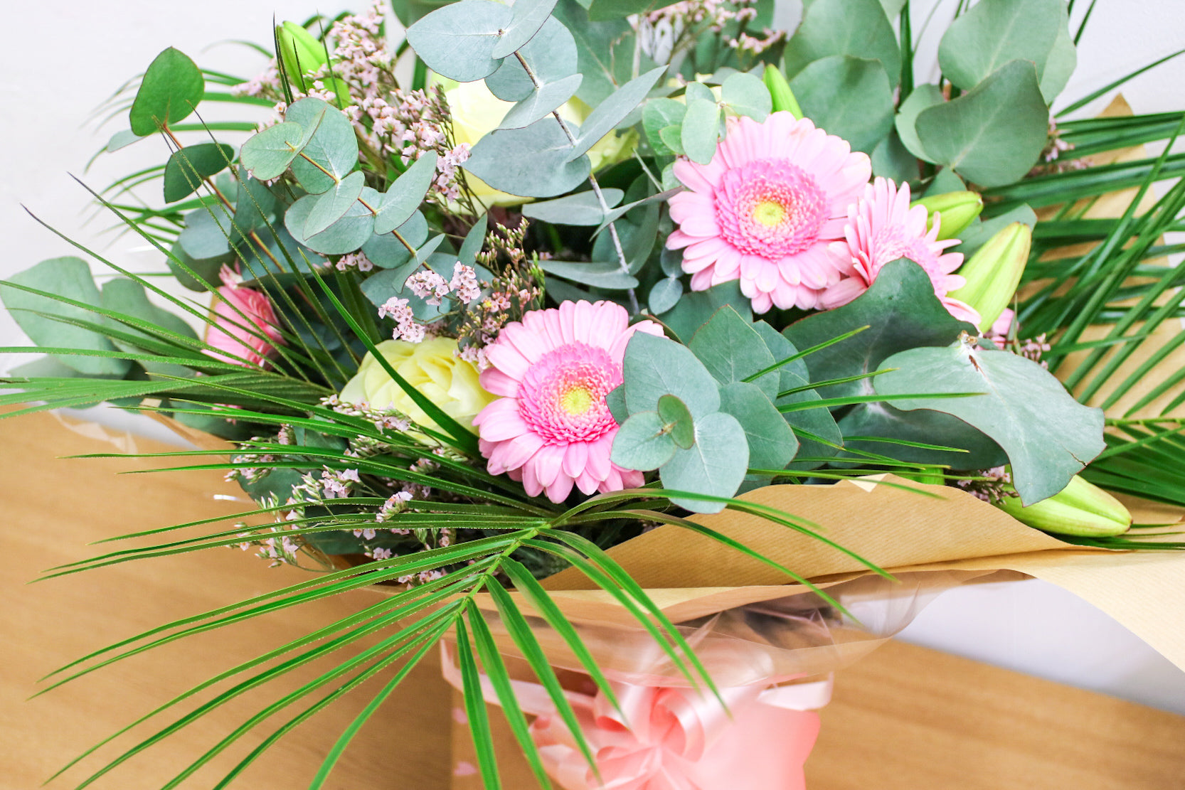  Hand-tied pink and white rose bouquet with gerberas and eucalyptus – The Sophia by Wildest Dreams Flowers

