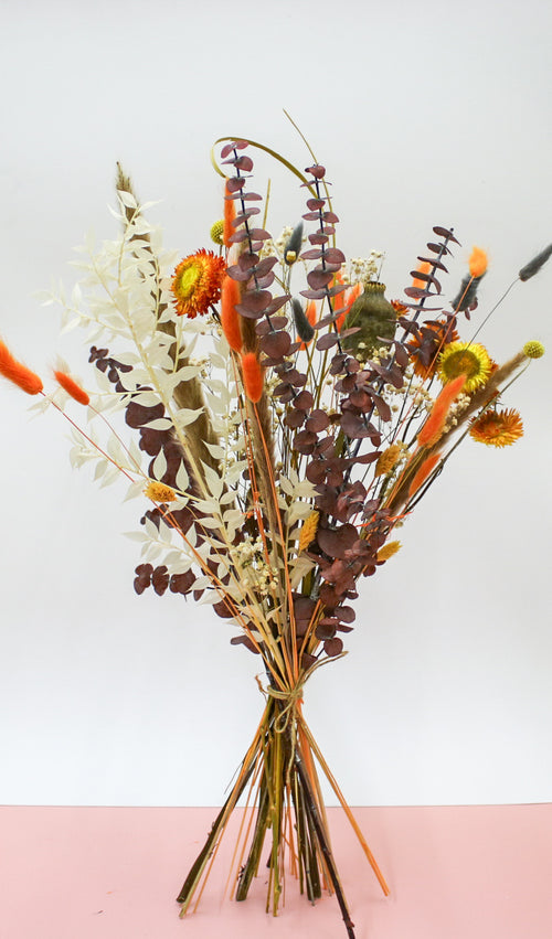 Dried orange and autumn bouquet with vibrant orange dried flowers