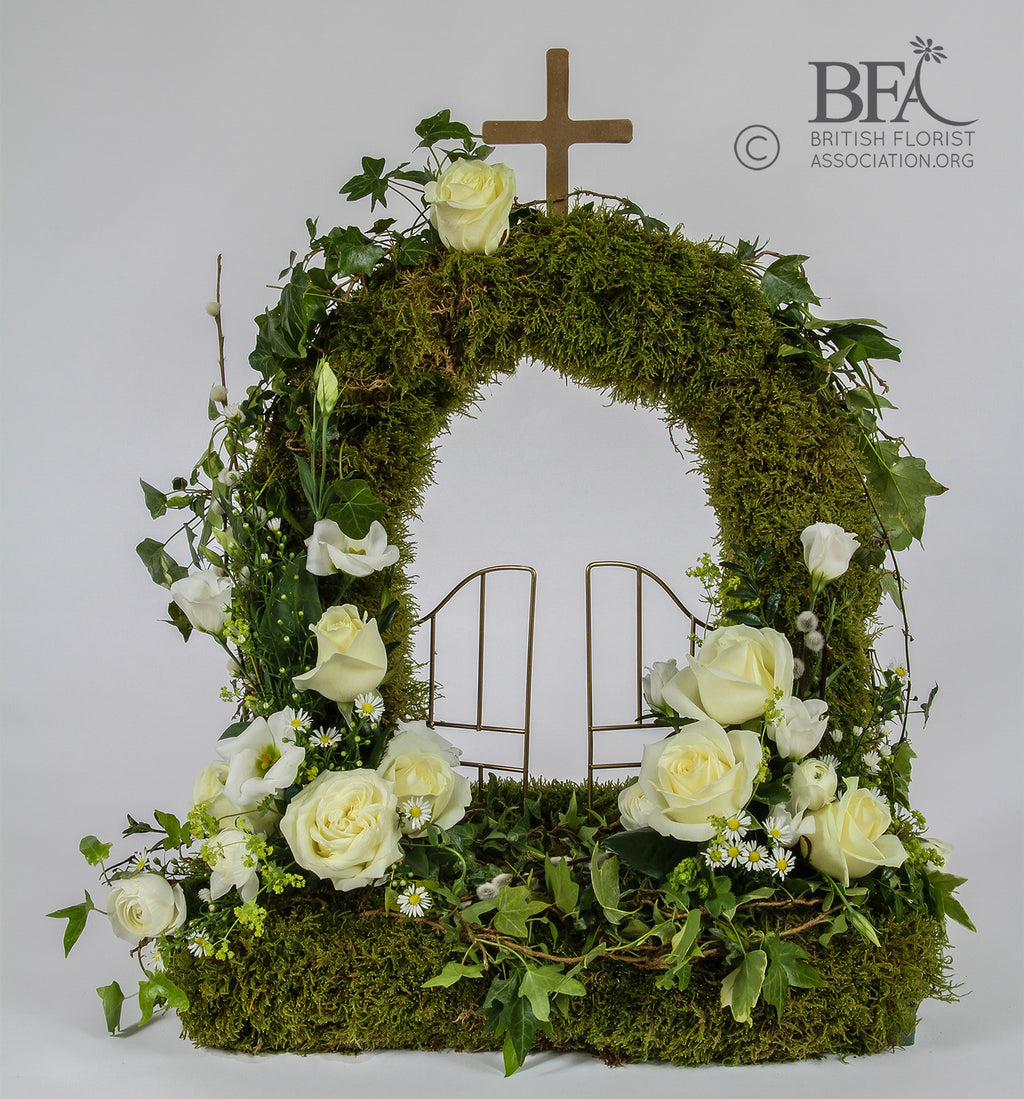 gates of heaven tribute, created with fresh flowers and moss in a beautiful design.