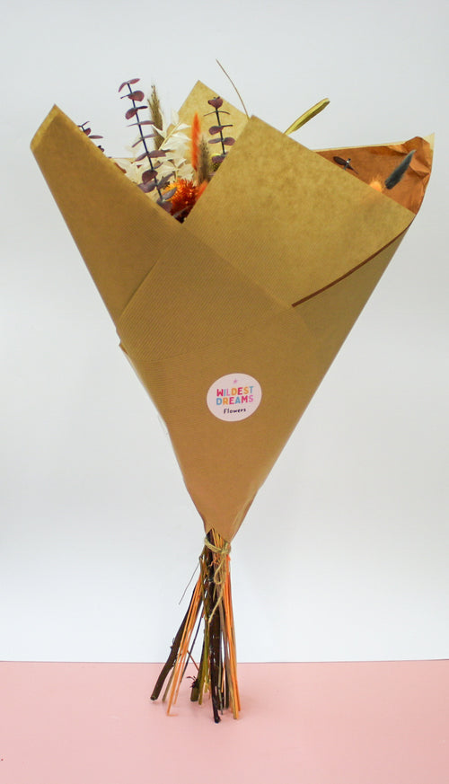 Beautiful orange dried flower bouquet with a mix of autumn hues 