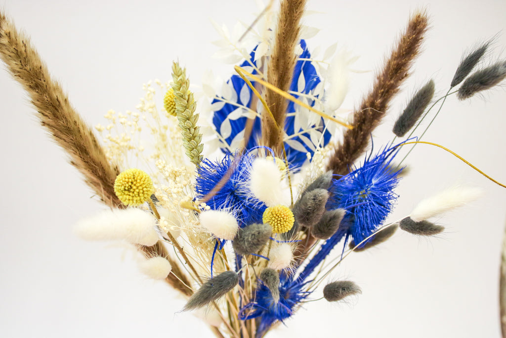 Stunning yellow and blue dried floral bouquet with soft pampas grass, creating a striking contrast. A beautiful addition to weddings, events, or as a unique home centerpiece