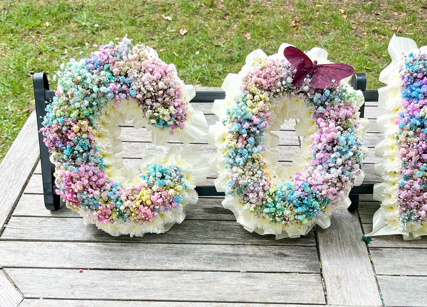 Rainbow Gypsophila Letter Tribute – Vibrant Personalized Funeral Floral Arrangement - Magic and Stars -funeral Flowers-Wildest Dreams Flowers